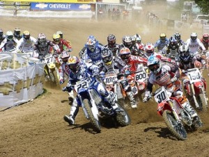 Millville 2004 start-sm Joaquim Rodrigues (108) cut across Alessi’s (800) front wheel in the first turn nearly putting the rookie on the ground in his pro debut at Millville in 2004. (Larry Lawrence photo)