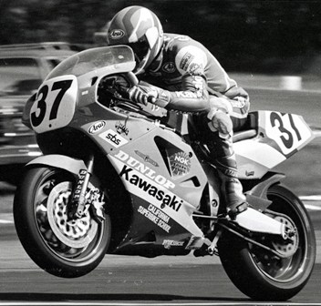 Chandler 3 Doug Chandler wheelies his Muzzy Kawasaki out of a turn at Brainerd International Raceway en route to winning an American round of the World Superbike Championship in 1990. (Larry Lawrence photo)