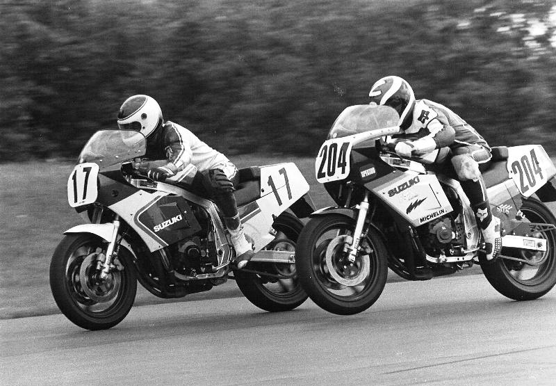 Wisconsin road racing aces John Eidenberger (17) and Scott Zampach (204) battle side by side at Grattan Raceway Park in a Suzuki Cup race circa 1986. Notice the front wheel slightly lofted on the Z-Man's GSXR. (Larry Lawrence photo)