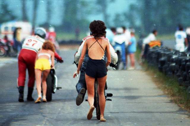 Love Is Love is a bikini-clad girlfriend or wife willing to help you bump-start your vintage racer. This from a WERA Vintage race at Talladega in 1986. (Larry Lawrence photo)