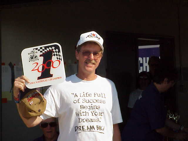 Jim Sublet holding his AMA Grand Champion class No. 1 plate. (Larry Lawrence photo)
