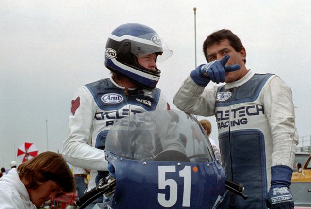 Cooley-Aldana David Aldana explains the track layout of Indianapolis Raceway Park to Wes Cooley prior to a practice session during a WERA National Endurance race weekend in 1985. (Larry Lawrence photo)
