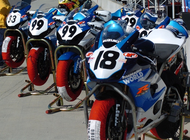 M4 Four A quartet of M4 EMGO Suzukis are lined up ready for practice at Barber Motorsports Park in 2005. The bikes are those of Chris Ulrich (18) Geoff May (99) and Vincent Haskovec (33). (Larry Lawrence photo)