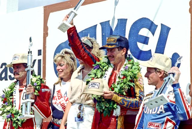 Renfrow podium at Loudon 86-sm Kork Ballington (2nd place), Randy Renfrow (winner) and Wayne Rainey (3rd place) share the podium at the Loudon AMA Motorcycle Classic in 1986. (Larry Lawrence photo)