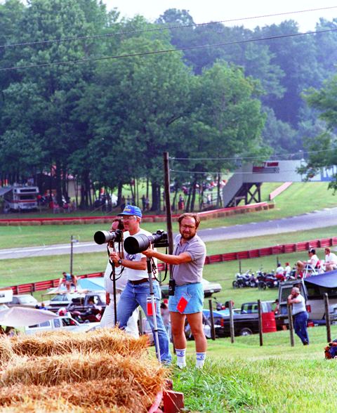 Riles and Flory Photographers Tom Riles (foreground) and John Flory shooting an AMA Superbike race in the mid-to-late 1980s. (Larry Lawrence photo)