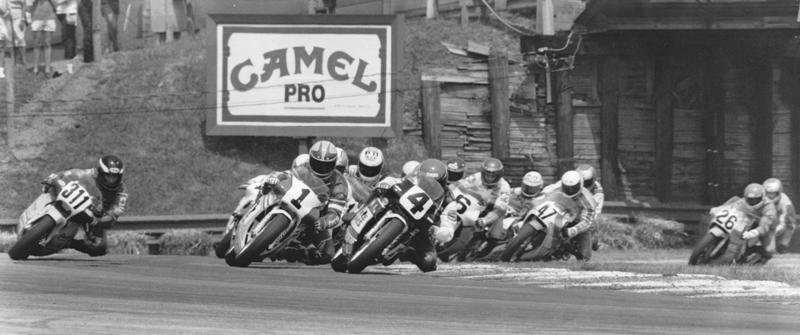 Renfrow - Mid-Ohio '87 Randy Renfrow (4) leads the start of the 1987 AMA 250 Grand Prix race at Mid-Ohio. Also in the photo is Donnie Greene (1), Andy Leisner (6), David Curtis (47), Greg Esser (26) and possibly Danny Coe (311) running wide through the first turn. (Larry Lawrence photo)