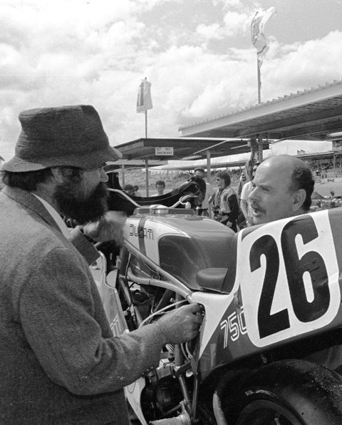 Cameron-Leoni - Daytona 1987-sm Kevin Cameron (in hat) an Reno Leoni talk shop during technical inspection of Jimmy Adamo's Ducati. (Larry Lawrence photo)