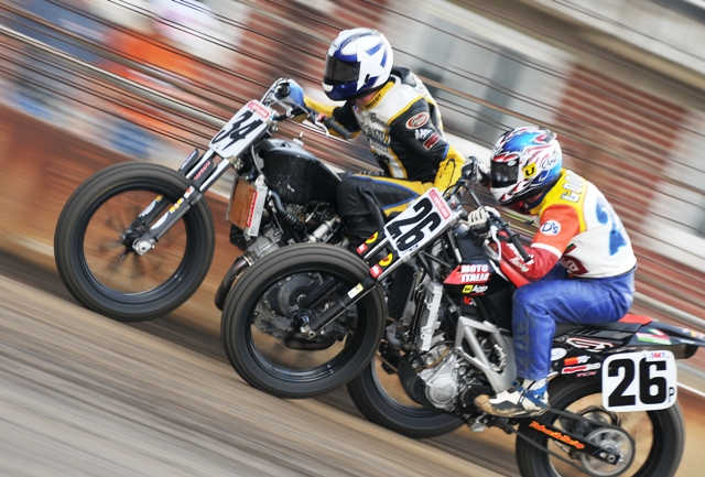 DeRuyter-Goodwin-sm Mack Daddy Racing Suzuki rider Jeremy DeRuyter reaching back and giving a serious stiff arm to Jon Goodwin and his Moto Italia Aprilia to keep him from passing on the front straight on the Springfield Mile last September. (Larry Lawrence photo)