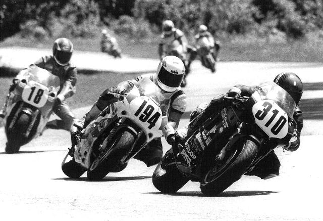 Hansen, Dave Dave Hansen (310) leads a 1991 WERA B Superbike race at Blackhawk Farms. Following Hansen is Steve Palella (194) and John Erdrich (18). Hansen held off Palelle and Erdrich to win the race. (Larry Lawrence photo)