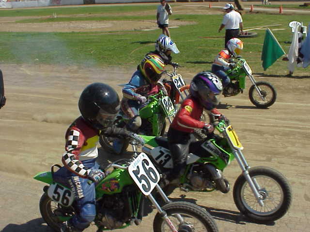 MVC-291S Nine-year-old Matthew Weidman gets the all-important holeshot over Keith Boulis (56) in the 65cc DTX final. Also shown in the photo is Chance McCormick (84), birthday boy John Lewis (21), who turned 11 Saturday, and John Long, the rider on the inside of the track. (Larry Lawrence photo)