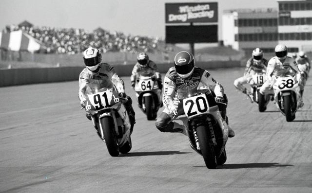 Rich Arnaiz, on the No. 20 Commonwealth Honda RC30, leads Steve Crevier (91), Larry Schwartzbach (61), Mike Smith (68) and Freddie Spencer (19) as the group dives into a corner at Heartland Park Topeka during a round of the 1991 AMA Superbike Championship. (Larry Lawrence photo)