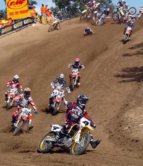 Budds 250 M1 start 05 Ricky Carmichael (4), Ryan Clark (38), Kevin Windham (14), Ernesto Fonseca (24) and Rusty Holland (67) make it through clean but the rest of the field has to deal with a first turn pileup at the Budds Creek National in 2005. (Larry Lawrence photo)