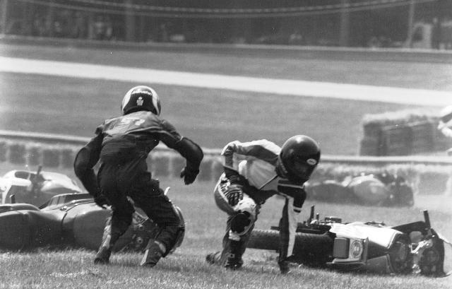 crash Ed Key (left) and another rider scramble to their feet and set off to search for their bike after a massive first-turn pileup in an AMA Supersport race at Mid-Ohio. (Larry Lawrence photo)