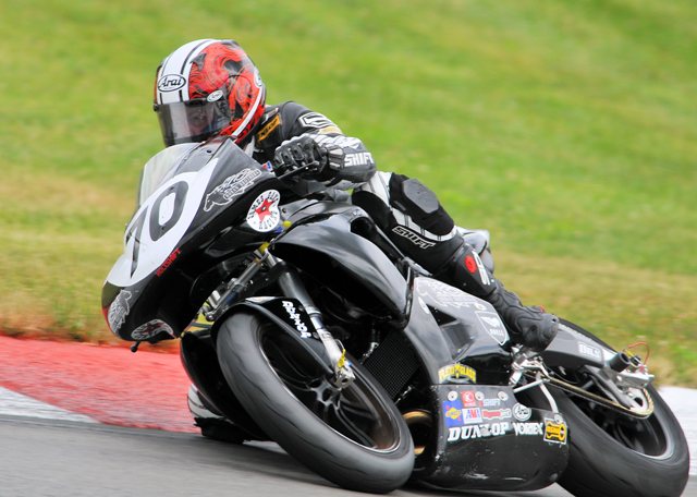 James Gang - Mid-O 09 James Gang/Hoban Brothers Racing’s Jeff Johnson leans the team’s Buell into a turn at Mid-Ohio Sports Car Course during the Moto-GT race on July 18, 2009. The team finished third. (Larry Lawrence photo)
