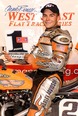 Jared Mees proudly displaying the AMA No. 1 plate at Pomona in Oct. of 2009. (Photo courtesy of Dave Hoenig/ www.flattrakfotos.com)