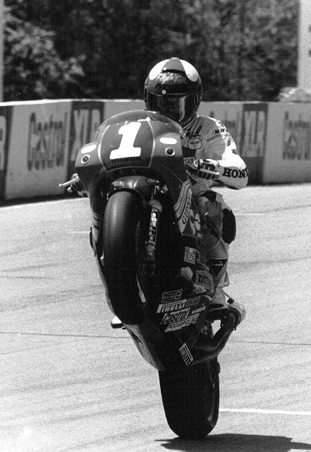 Merkel - Mosport World Superbike Champion Fred Merkel wheelies his Honda over the finish line after winning the first leg of the Canadian World Superbike round at Mosport in 1989. (Larry Lawrence photo)