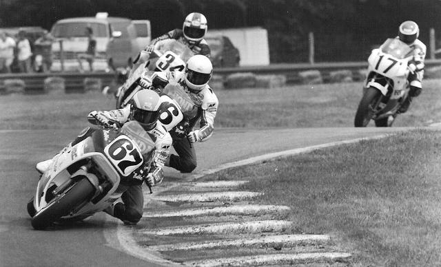 Shobert - 1987 Mid-O Honda Superbike riders Bubba Shobert (67) and Wayne Rainey (6) lead the way in the 1987 Mid-Ohio AMA Superbike race. Yoshimura Suzuki’s Kevin Schwantz (34) runs third and Yamaha ace Jimmy Filice (17) is fourth. Schwantz moved up to win the race. (Larry Lawrence photo)