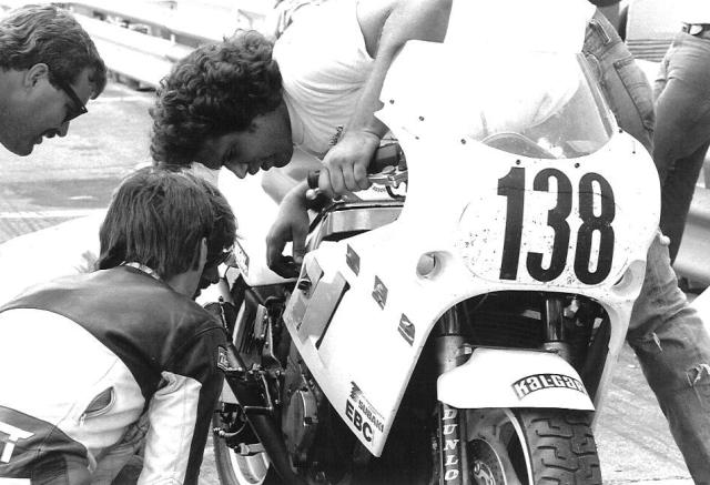 House - 3-D Tom Houseworth leans over the 3-D Racing Suzuki after the machine blew a motor at Road Atlanta during a 1989 WERA National Endurance race. I believe the rider in the leathers looking at the engine is Mark McDaniel. (Larry Lawrence photo)