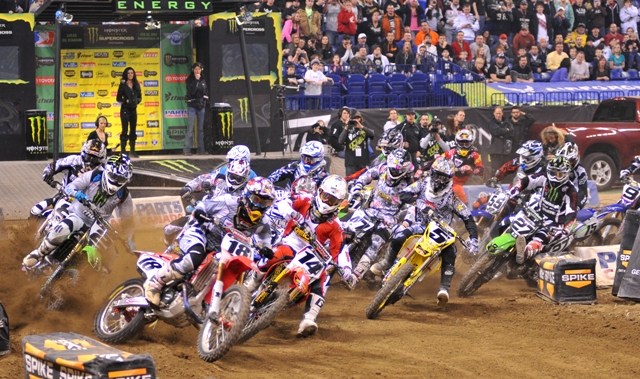 Indy SX start 2010 Davi Millsaps (18) shows the perfect line through the first turn at the Indy Supercross. (Larry Lawrence photo)