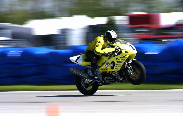 Vesrah - Batey - Putnam 2002 Tray Batey wheelies onto the front straightaway at Putnam Park Road Course during a WERA National Endurance race in 2002. (Larry Lawrence photo)