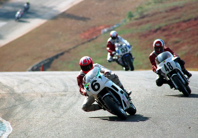 Brian Gristick (6) leans his bike into the turn heading under the Nissan Bridge at Road Atlanta in its original configuration during the WERA Grand National Finals in 1991. (Larry Lawrence photo)