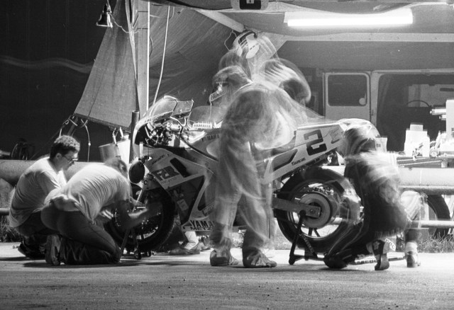 HRT Ghost Crew The Human Race Team’s crew takes on a ghost–like appearance during a pit stop at the WERA Nelson Ledges 24-Hour National Endurance race. This was a long exposure photo taken with the camera braced on the pit wall. (Larry Lawrence photo)