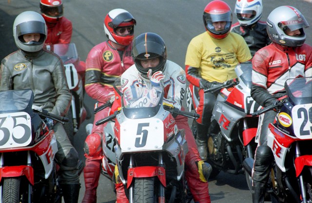Jeff James (5) and a group of other riders stage in the pits for a practice session during a WERA race weekend at Road Atlanta in May of 1986. Also visible in the photo are Neil Barker (35), Buck Clemson (behind James) and Bob Englert (on the Pennzoil sponsored Yamaha). (Larry Lawrence photo)