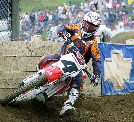RC-Moto1-Mt. Morris 04 Ricky Carmichael banging off the wall below the announcers tower at High Point Raceway in Mt. Morris, Pa., during the 2004 High Point National. (Larry Lawrence photo)