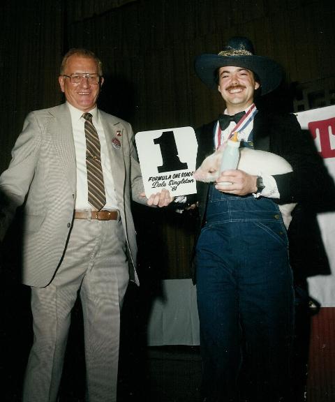 Dale Singleton holds baby pig Elmer when accepting the 1981 AMA Formula One number one plate from AMA Competition Director Bill Boyce at that year’s awards banquet.