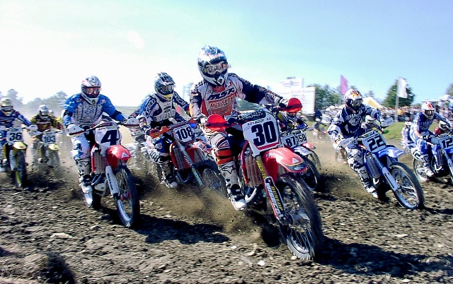 Anderson, Craig - 2004 Binghamton sm Craig Anderson nails the holeshot and leads Ricky Carmichael (4), Joaquim Rodrigues (108), Chad Reed (22) and the rest of the field in the 250 National at Broome-Tioga Sports Center near Binghamton, N.Y., in August if 2004. (Larry Lawrence photo)