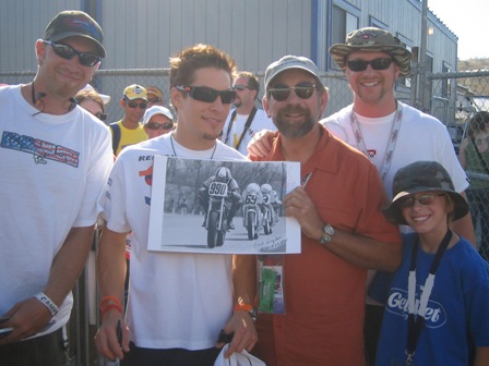 Demopoulos 2 The photo being autographed by Nicky Hayden on the day he won his first MotoGP on his way to winning the world championship at Laguna in 2006. Pictured left to right are - Nick Demopoulos (Chris’ son), Nicky Hayden, Chris Demopoulos, Greg Demopoulos (Chris’ son) and Alexi Demopoulos (Chris’ grandson).