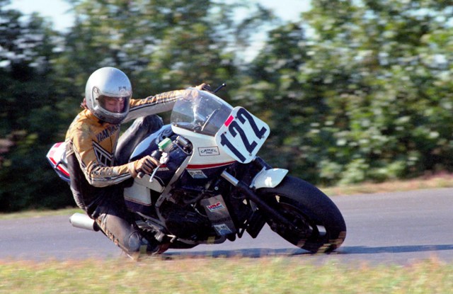 Phil Pummell corners his Honda Superbike in a WERA race at Grattan Raceway with the camera catching him blinking his eyes. (Larry Lawrence photo)