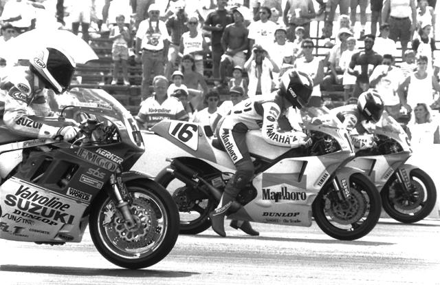 Donald Jacks, on the Valvoline Suzuki and the Marlboro Yamahas of Robbie Petersen (16) and Rich Oliver launch off the line at the start of the WERA Formula USA Championship round at Moroso Motorsports Park in September of 1991. Oliver shattered the Moroso track record in qualifying with a 1:20 flat (101.275 mph) and went on to win both legs of F-USA races. (Larry Lawrence photo)