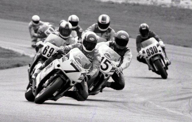 Haldane, Chris - Grattan 7-91 Chris Haldane leads Stevie Patterson (15), Thomas Wilson (691) and other riders in a WERA sprint race at Grattan Raceway in July of 1991. (Larry Lawrence photo)