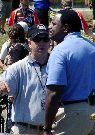 Pat and JB Pat Schutte explains motocross to J.B., that’s TV sports personality James Brown, who was doing a piece on James Stewart for HBO’s Real Sports. (Larry Lawrence photo)
