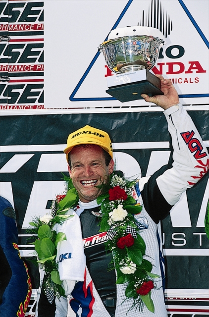 Steve Crevier holds up the winner’s trophy after winning the Pro Honda Oil 600cc Supersport race at Mid-Ohio in 1998. Crevier came out on top of one of the deepest fields in the history of Supersport racing to win the championship that season. (Dunlop press kit photo)