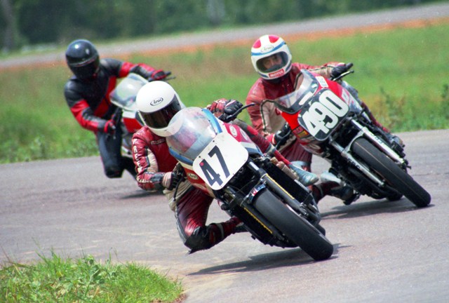 Expert Charlie Daniell, riding what I think is a Honda VF750, leads novice racers Patrick Harris, on a Yamaha FJ600 and Yamaha FZ750 mounted Jeff Duckworth through a turn at Talladega Grand Prix Raceway during a WERA B Superbike sprint race in August of 1986. (Larry Lawrence photo)