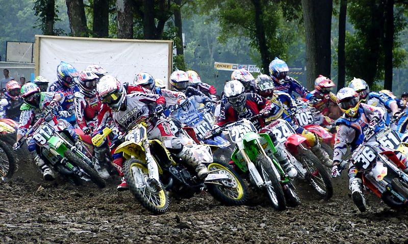 Troy 125 start - 2002 Danny Smith (37) nails the holeshot at the start of the 2002 AMA 125cc Motocross National in Troy, Ohio. James Stewart (259) is right behind Smith trying to stay out of the way of the jostling pack. Taking the high line around the outside is Steve Boniface (36). (Larry Lawrence photo)