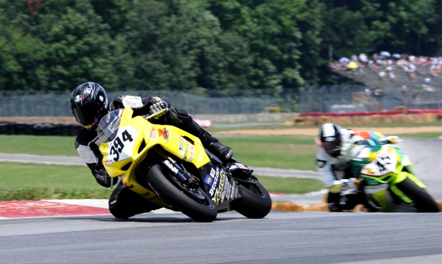 Dellinger - Antoine Richards James Dellinger (394) got by Antoine Richards late in the Sunday Mid-Ohio SuperSport race. (Larry Lawrence photo)
