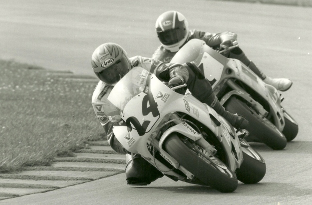 Chuck Graves, on the No. 24 Valvoline Suzuki races with New Zealander Andrew Stroud on a Dutchman Suzuki in the second leg of the WERA Pro Series Formula USA race at Indianapolis Raceway Park on August 9, 1992. Graves held off Stroud at the flag. (Larry Lawrence photo)
