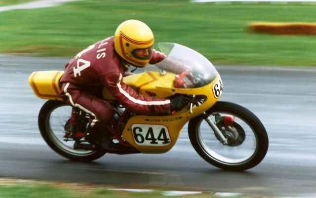 Hollis, Lynn - IRP 1986 Lynn Hollis racing his 1978 Honda MT125R, air-cooled GP racer in the rain at Indianapolis Raceway Park in 1986 in WERA Formula 3. Hollis turned in some great rides on his little Honda GP bike, which by that time was verging on being a vintage machine. (Larry Lawrence photo)