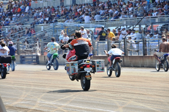 Joe Kopp does the seemingly impossible, pulling a monster wheelie on J.B. Norris’ famous BMW GS down the front straight of the Springfield (Ill.) Mile during a lap of honor for Norris, the well-known national flat track announcer who died in June of 2008. Kopp not only got the front wheel of the big GS in the air, he actually held the wheelie for a good distance down the straightaway. (Larry Lawrence photo)