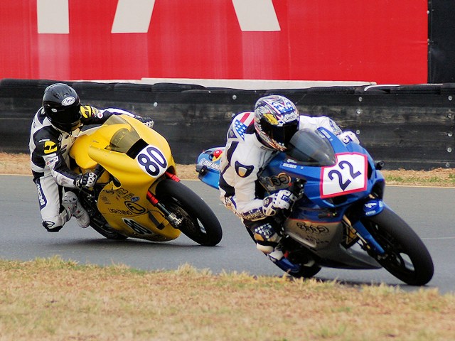 Shawn Higbee (22) and Michael Barnes (80) raced in May at Infineon Raceway in the TTXGP U.S. Championships, marking the first-ever zero-carbon motorcycle race in the United States. Higbee took the victory. (Mike Finnegan photo)