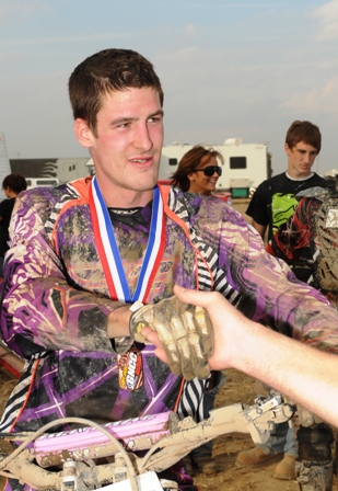 Rookie sensation Chris Bach receives congratulations after his podium finish in this year’s grueling Ironman GNCC, near Crawfordsville, Indiana, on Oct. 24, 2010. (Larry Lawrence photo)