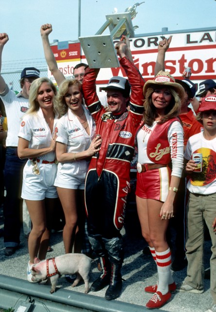 Dale Singleton on the podium celebrating his upset win in the 1981 Daytona 200. The Georgian went on to win the AMA Road Racing Championship that year. The baby pig Elmer can be seen at the bottom of the photo. Singleton’s nickname was the “Flying Pig Farmer” even though he wasn’t really a pig farmer Singleton was a smart enough marketer to know that cultivating that image would spread his image throughout the world. It paid off as Singleton was paid big money by promoters to come over to Europe to compete in various races. (Rich Chenet photo)