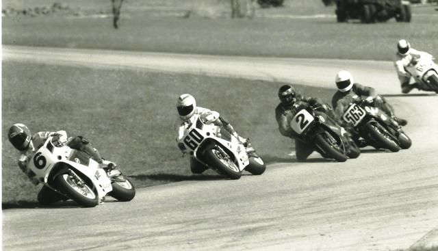 Smith - Roebling Mike Smith (6) leads a pack that includes Kurt Hall (60), Tripp Nobles (2), Jay Denham (563) and Mike Harth (65) in a WERA A Superstock race at Roebling Road in the early 1990s. Smith pulled away to take the victory in the Suzuki-paying race. Hall finished second and Harth moved up to take third. (Larry Lawrence photo)