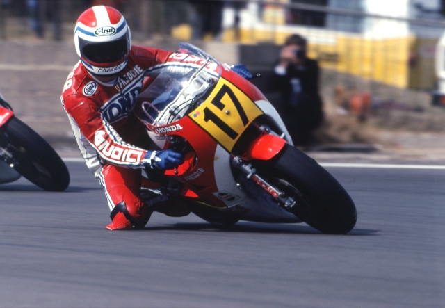 A close-up view of Freddie Spencer cornering Honda’s revolutionary oval piston NR500 at Silverstone. While the NR was not considered a major success, the engineering Honda used in its amazing Honda NR750 street bike, the most expensive street motorcycle ever sold at today’s equivalent of $90,000. 