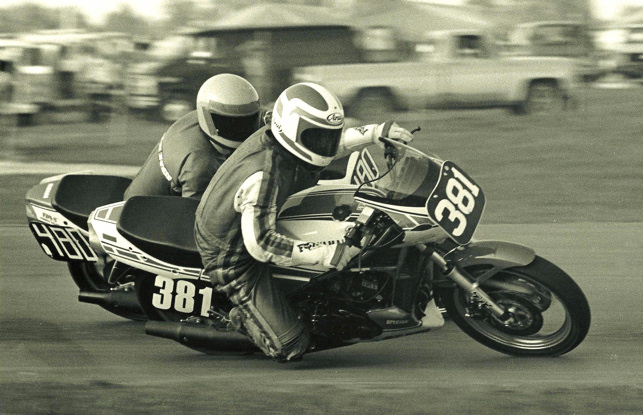 Jerry Washburn (381) and Richard Koenig (480) battle side by side in a WERA D Production Novice race through the carousel at Indianapolis Raceway Park in the mid-1980s. Washburn won. (Larry Lawrence photo)