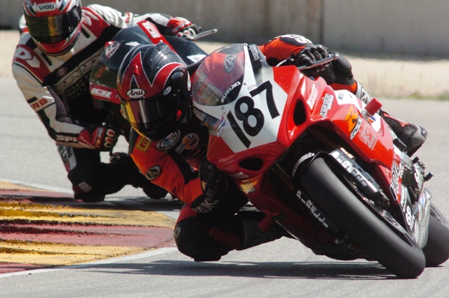West, Cory - Elkhart '05 Cory West, racing the Team HotBodies/Pirelli Suzuki GSXR1000, leads Honda mounted Jeremy Toye in the AMA Superbike race at Road America in Elkhart Lake, Wisconsin, in June of 2005. (Larry Lawrence photo)