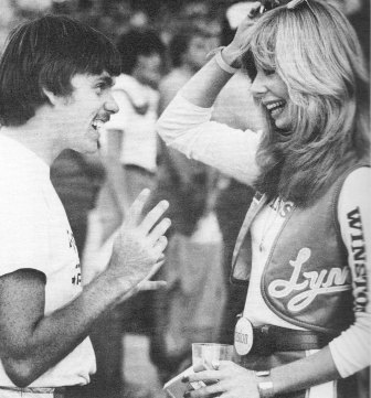 Mike Kidd looks like he's working it hard as he talks with Miss Camel (Winston) Lynn Griffis.